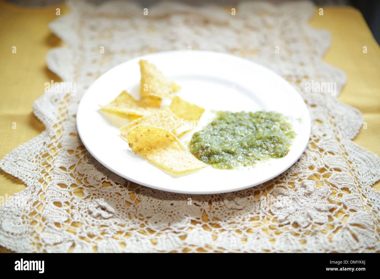 Tortilla chips and Salsa Verde Stock Photo
