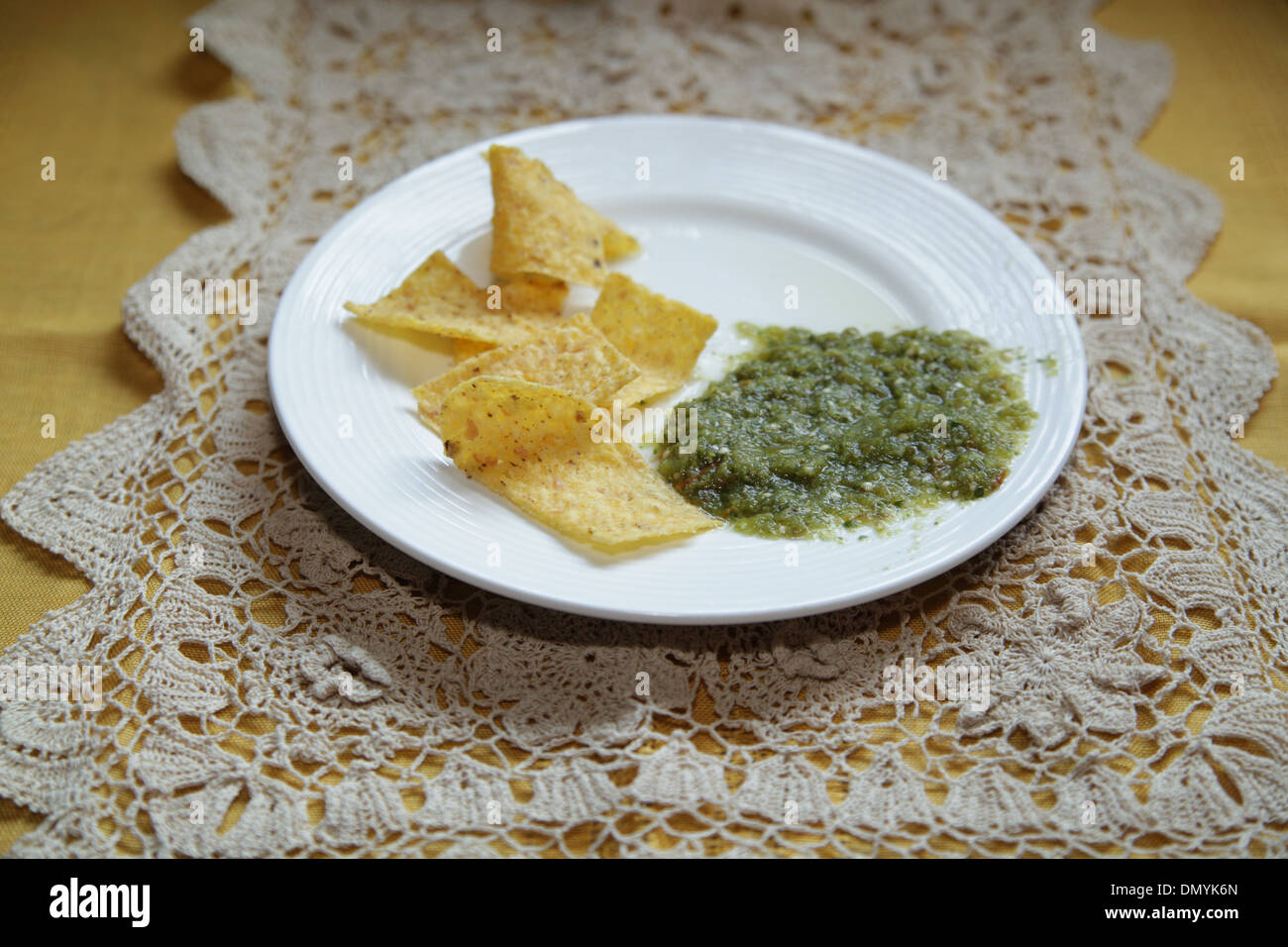 Tortilla chips and salsa verde Stock Photo Alamy