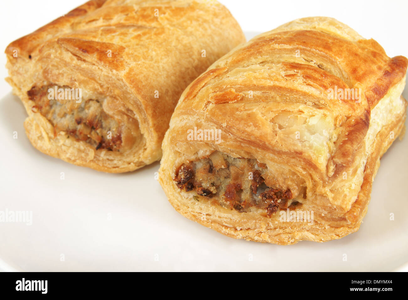 Pork sausage rolls in puff pastry on a plate Stock Photo Alamy