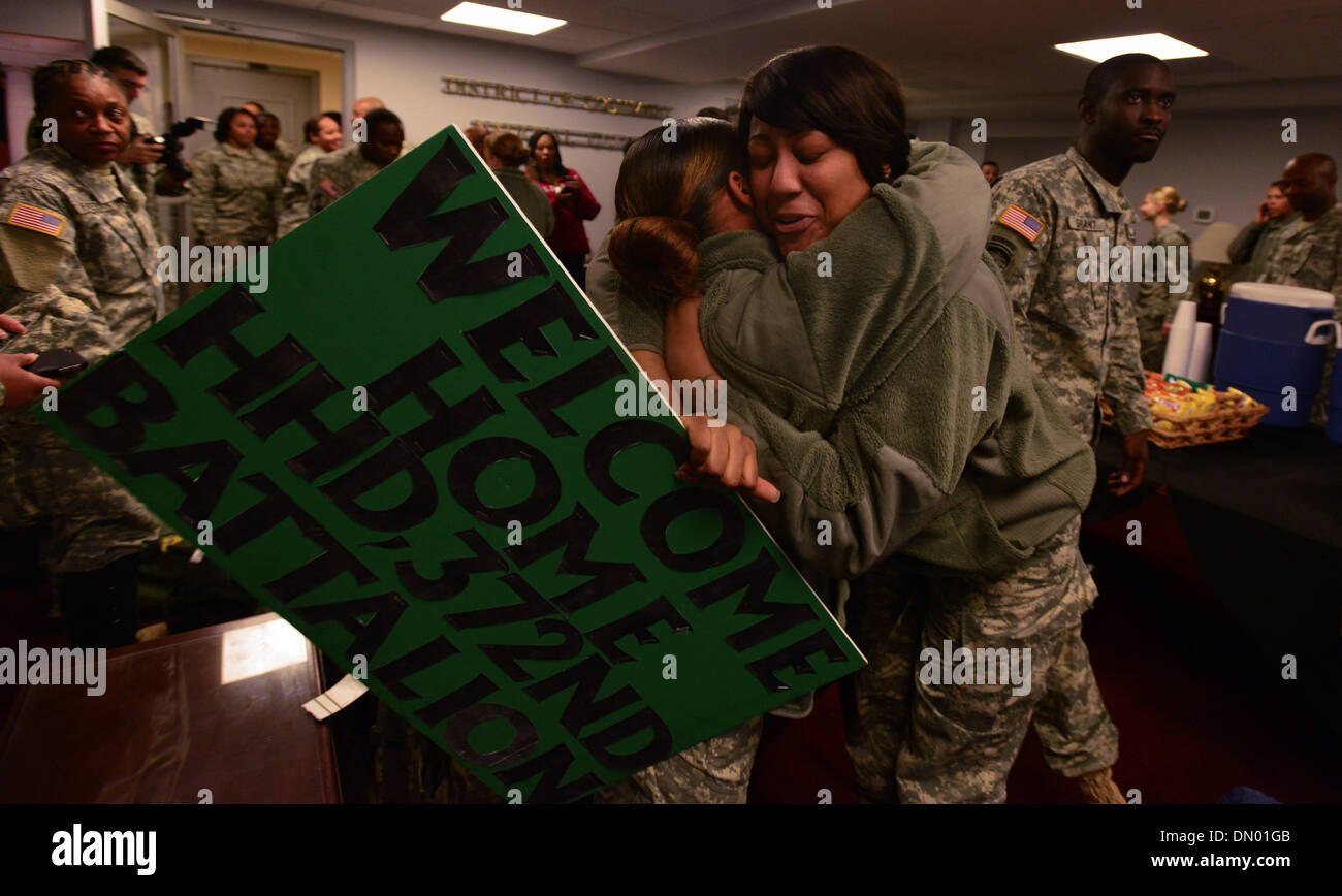 Washington, District of Columbia, US, USA. 17th Dec, 2013. Soldiers of the D.C. Army National Guard's 372nd Millitary Police Battalion celebrate their return home for the holidays at the DC Armory during a homecoming ceremony for nearly 50 soldiers from D.C.'s Army National Guard 372nd Military Police Battalion. The soldiers were returning from a 10-month deployment to Guantanamo Bay, Cuba, in support of Operation Enduring Freedom. Credit:  Miguel Juarez Lugo/ZUMAPRESS.com/Alamy Live News Stock Photo