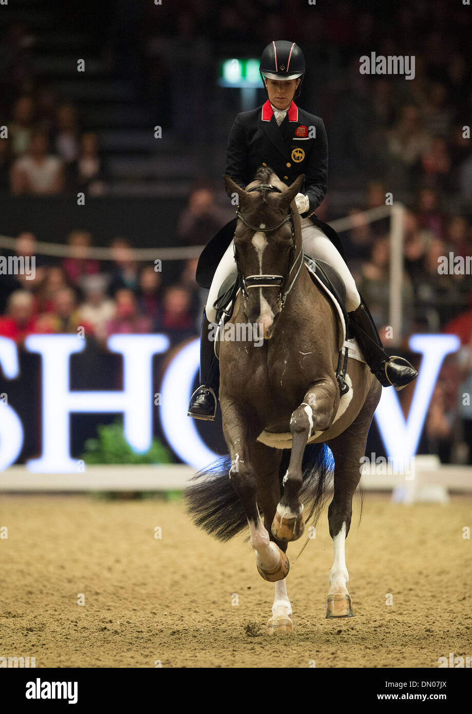 London, UK. 17th December 2013.  British Olympic and European Champion Charlotte Dujardin set a new world record score for Freestyle Dressage with her horse Valegro, the pair scored 93.975% in the Reem Acra FEI World Cup at The London International Horse Show.  The London International Horse Show takes place between 16th - 21st December at Olympia.  Credit:  Stephen Bartholomew/Alamy Live News Stock Photo