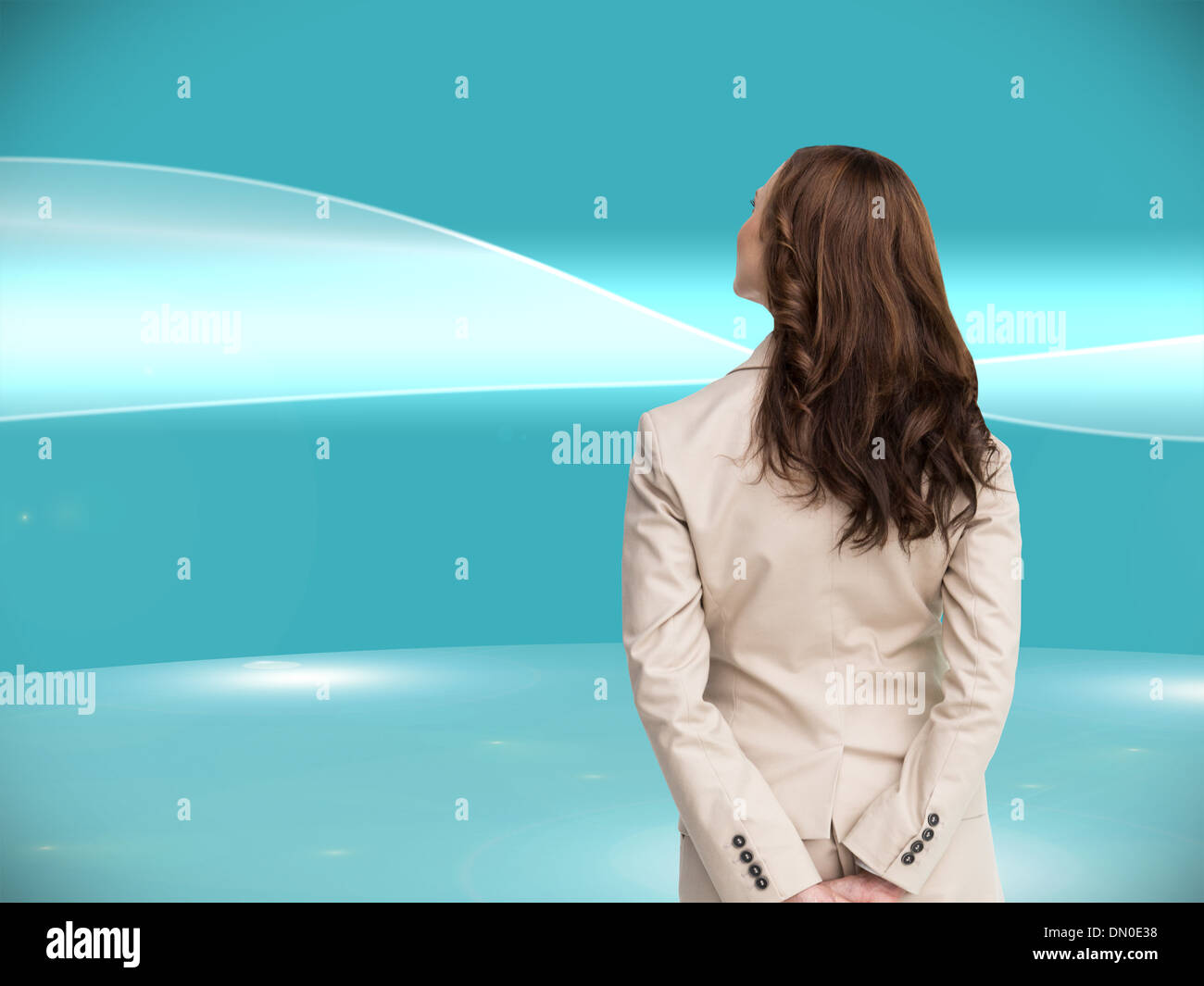 Composite image of rear view of businesswoman Stock Photo - Alamy