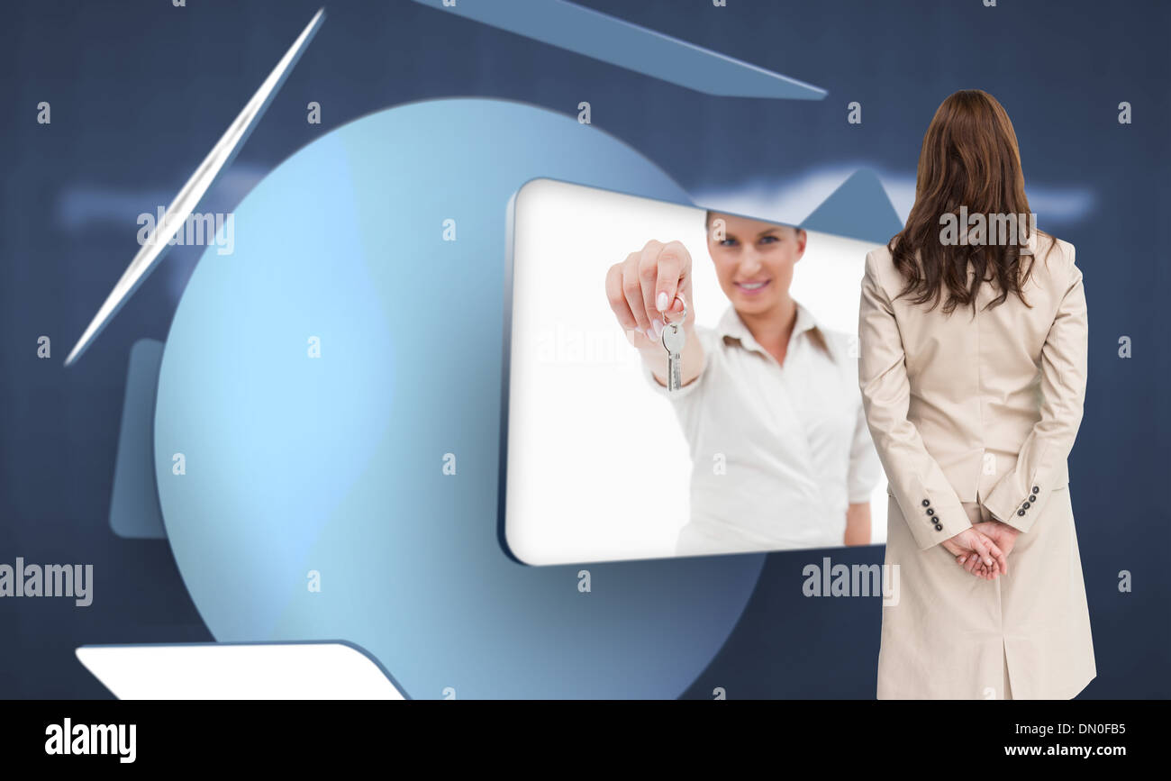 Composite image of rear view of businesswoman Stock Photo - Alamy