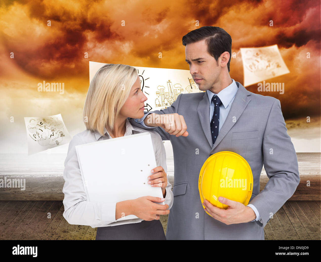 Composite image of architects with plans and hard hat looking at each other Stock Photo