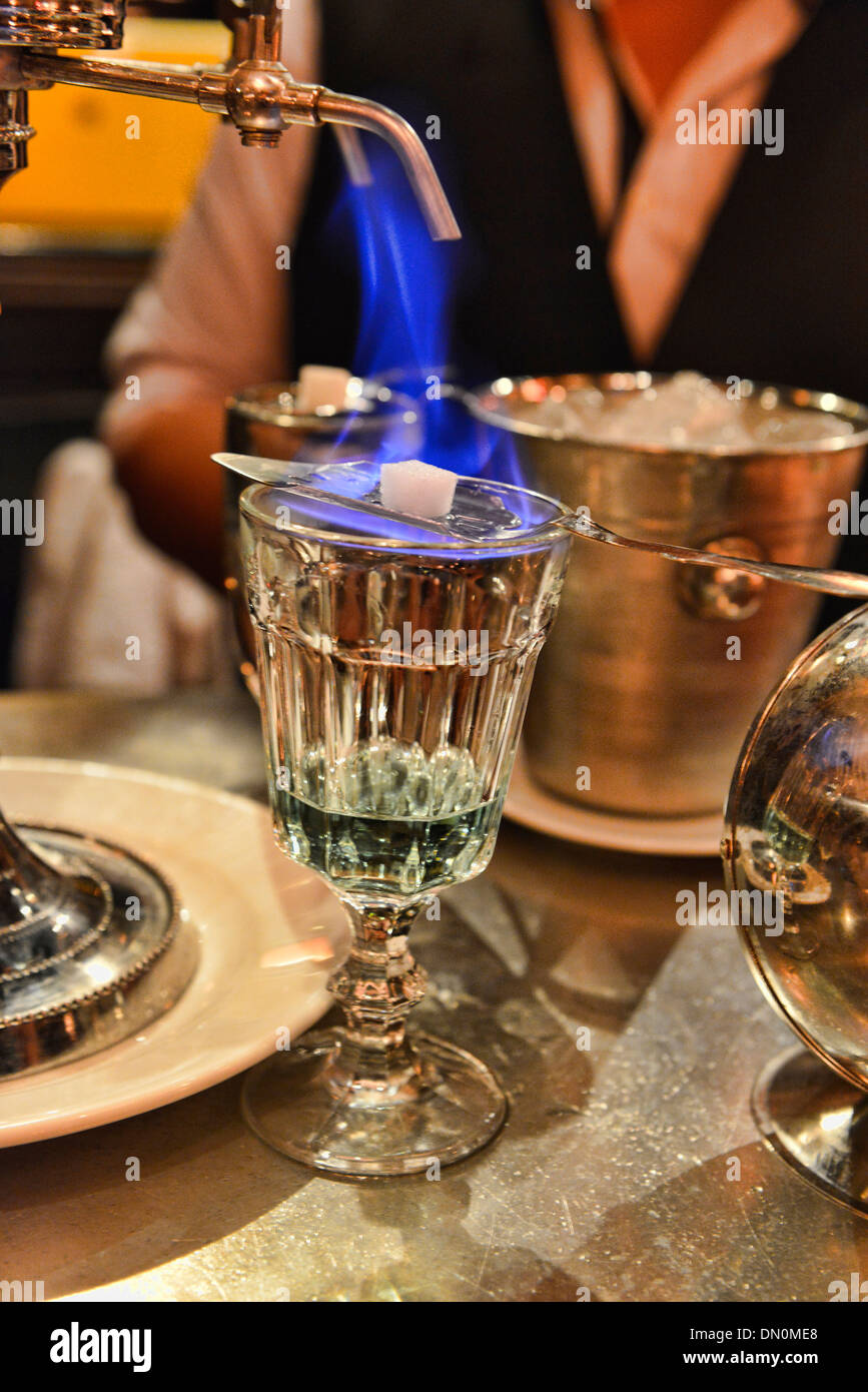 pouring absinthe the traditional way, Bangkok, Thailand Stock Photo