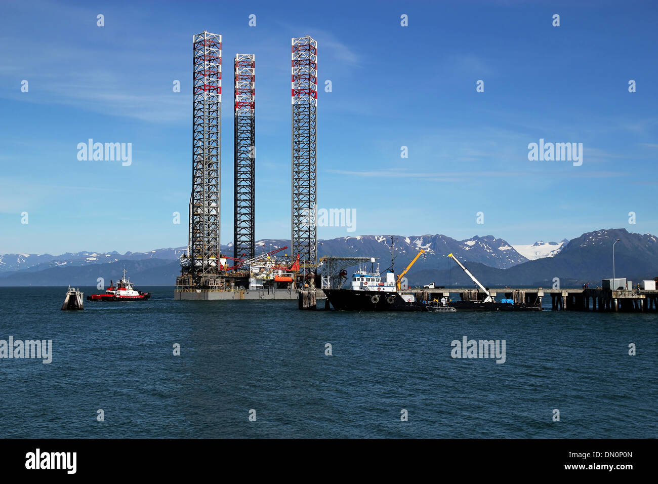 Jackup oil drilling rig at a dock in Homer Alaska on a sunny day. Stock Photo