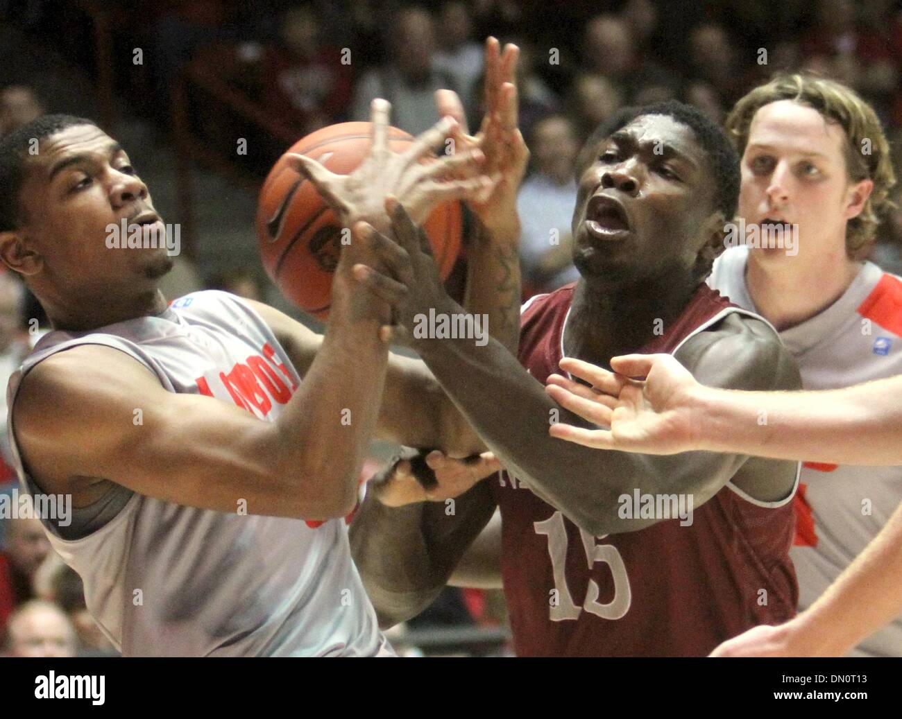 Dec. 17, 2013 - U.S. - SPORTS -- UNM's Arthur Edwards, left, and New Mexico State's Tshilidzi Naphawe, 15, battle for a rebound as UNM's Cameron Bairstow, right, watches during the game in the Pit on Tuesday, December 17, 2013. (Credit Image: © Greg Sorber/Albuquerque Journal/ZUMAPRESS.com) Stock Photo