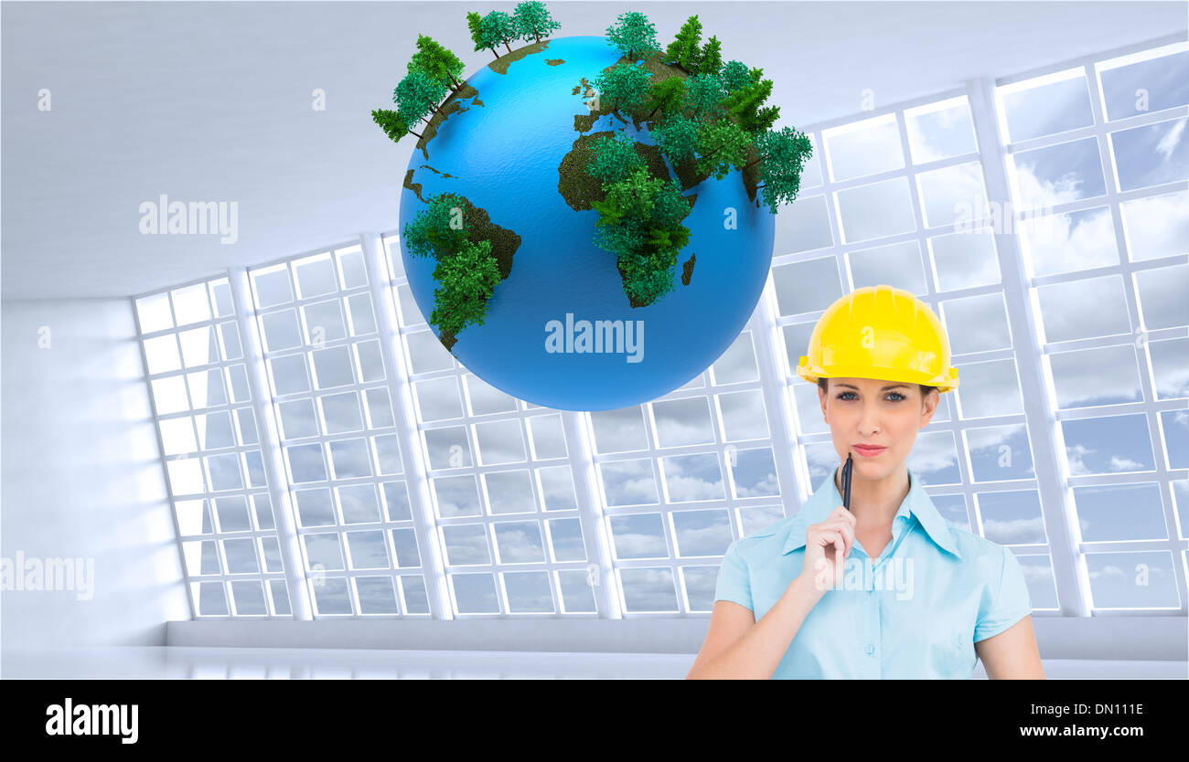 Composite image of thoughtful attractive architect holding clipboard Stock Photo