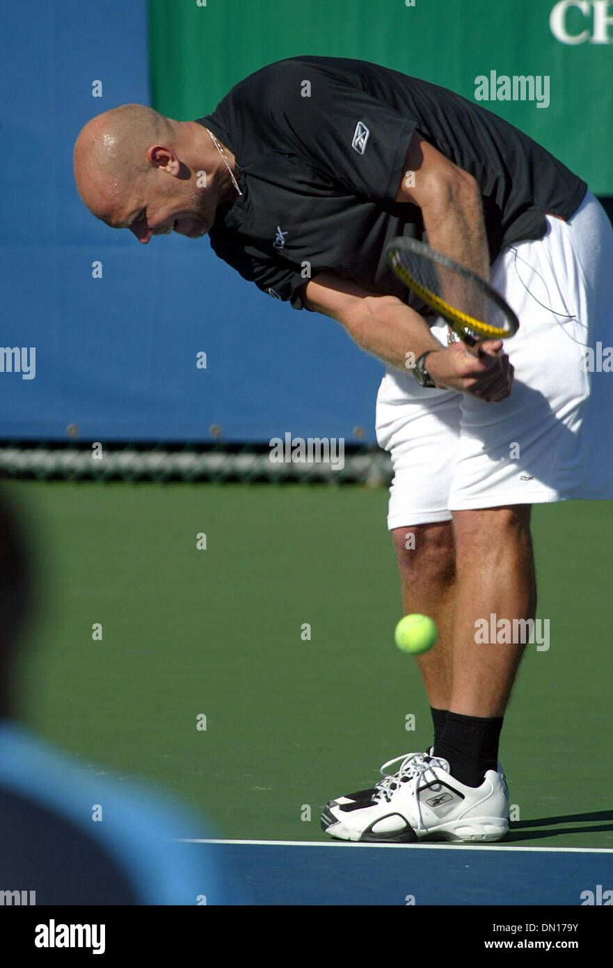 Dec 03, 2005; Delray Beach, FL, USA; Tennis star Murphy Jensen makes what he called this Tiger Woods serve (hitting the ball off the court surface) during his doubles match with partner Michael W. Smith against  his brother Luke Jensen and actor Alan Thicke at the 2005 Chris Evert Bank of America Pro-Celebrity Tennis Classic at the Delray Beach Tennis Center, Saturday.  Mandatory C Stock Photo