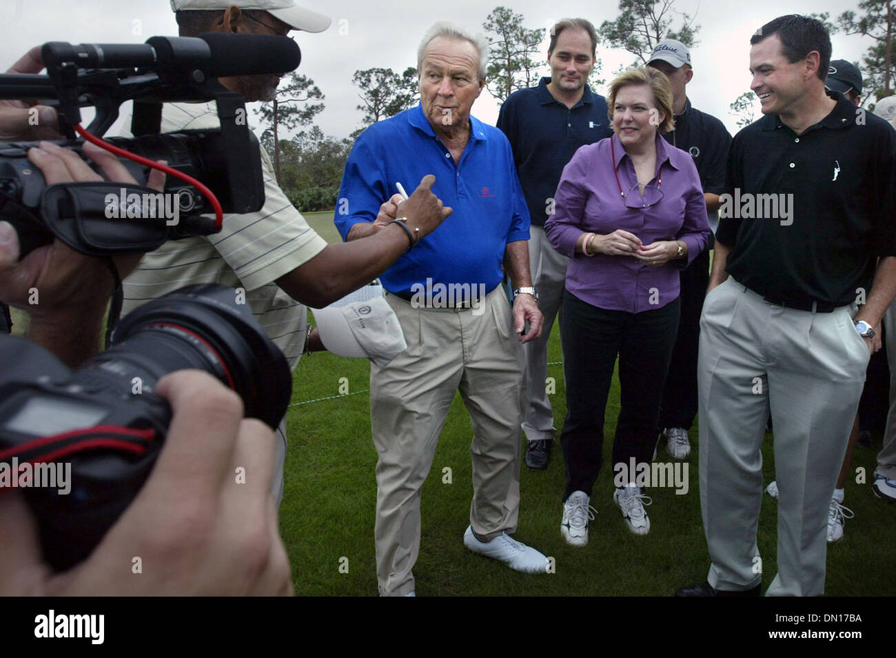 Dec 06, 2005; Port St. Lucie, FL, USA; Golfing legend Arnold Palmer was on hand during the grand opening of the Arnold Palmer designed golf course at Tesoro tuesday.  Here, after completing nine holes, Palmer prepares to sign an autograph for a fan at far left.  Mandatory Credit: Photo by David Spencer/Palm Beach Post/ZUMA Press. (©) Copyright 2005 by Palm Beach Post Stock Photo