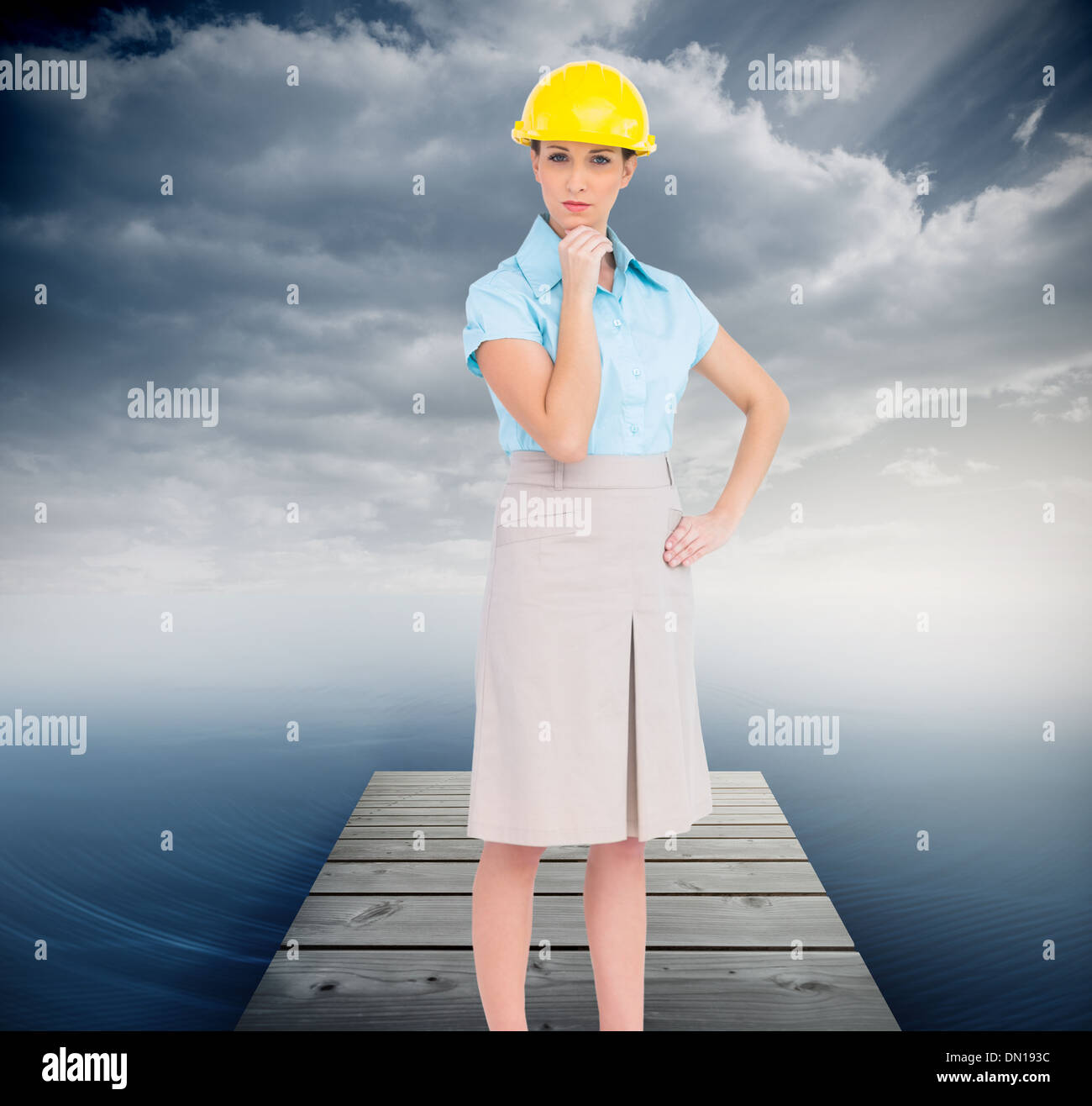 Composite image of thoughtful attractive architect posing Stock Photo