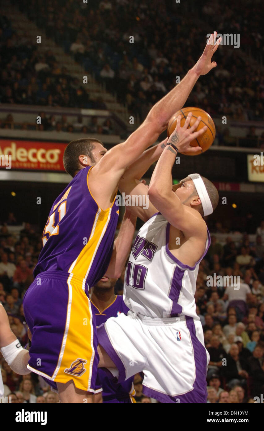 Jan 19, 2006; Sacramento, CA, USA; Kings guard MIKE BIBBY scores over Lakers CHRIS MIHM in the 4th quarter in Thursday nights game between the Sacramento Kings and Los Angeles Lakers at Arco Arena. California. The Kings won in overtime 118-109.  Mandatory Credit: Photo by J L Villegas/Sacramento Bee/ZUMA Press. (©) Copyright 2006 by J L Villegas/Sacramento Bee Stock Photo