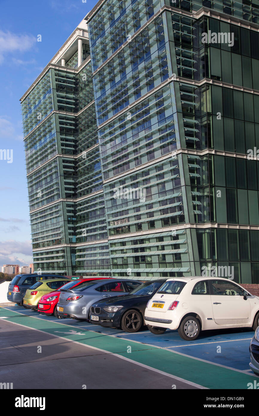 Roof top car park with glass buildings, Birmingham, England,UK Stock