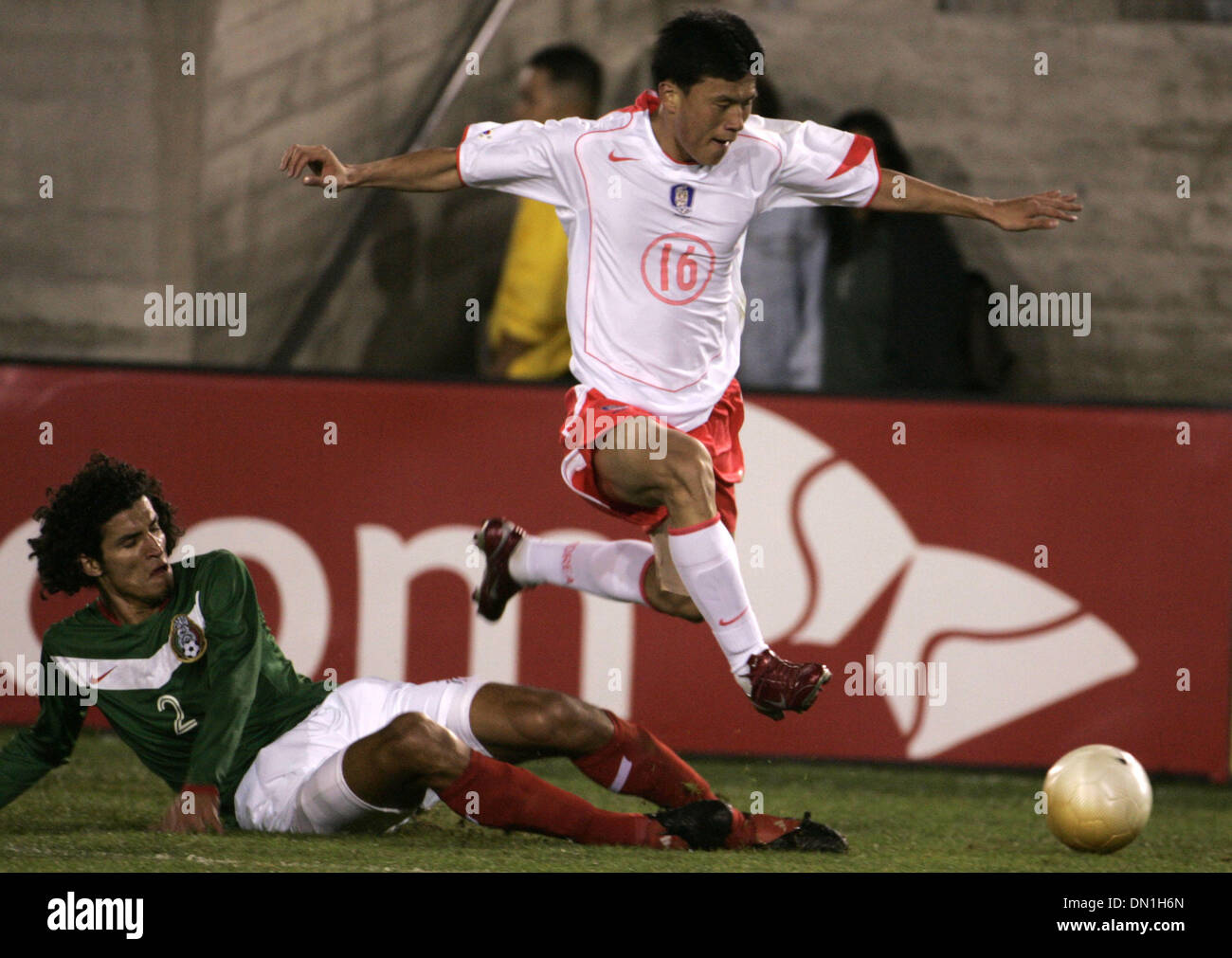 Feb 15, 2006; Los Angeles, CA, USA; SOCCER: (2) Francisco Rodriguez from the National Team of Mexico  fights for the ball against (16) Kyung-Ho Chung from the national team of Korea Republic during their tune up match prior to the world cup at the Los Angeles Memorial Coliseum Wednesday 15 February 2006. Korea won the game 1-0. Mandatory Credit: Photo by Armando Arorizo/ZUMA Press. Stock Photo