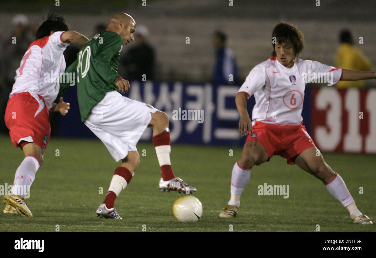 Feb 15, 2006; Los Angeles, CA, USA; SOCCER: (10) Adolfo Bautista from the National Team of Mexico  fights for the ball against (6) Kim Jin-Kyu  and another defender from the national team of Korea Republic during their tune up match prior to the world cup at the Los Angeles Memorial Coliseum Wednesday 15 February 2006. Korea won the game 1-0. Mandatory Credit: Photo by Armando Aror Stock Photo