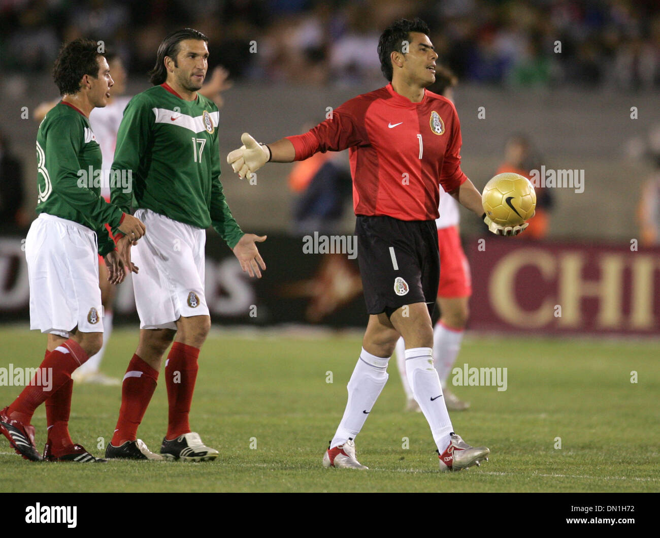 Feb 15, 2006; Los Angeles, CA, USA; SOCCER: Goalie (1) Oswaldo Sanchez of the National Team of Mexico  handles the ball as team mates look on during their tune up match prior to the world cup at the Los Angeles Memorial Coliseum Wednesday 15 February 2006. Korea won the game 1-0. Mandatory Credit: Photo by Armando Arorizo/ZUMA Press. (©) Copyright 2006 by Armando Arorizo Stock Photo