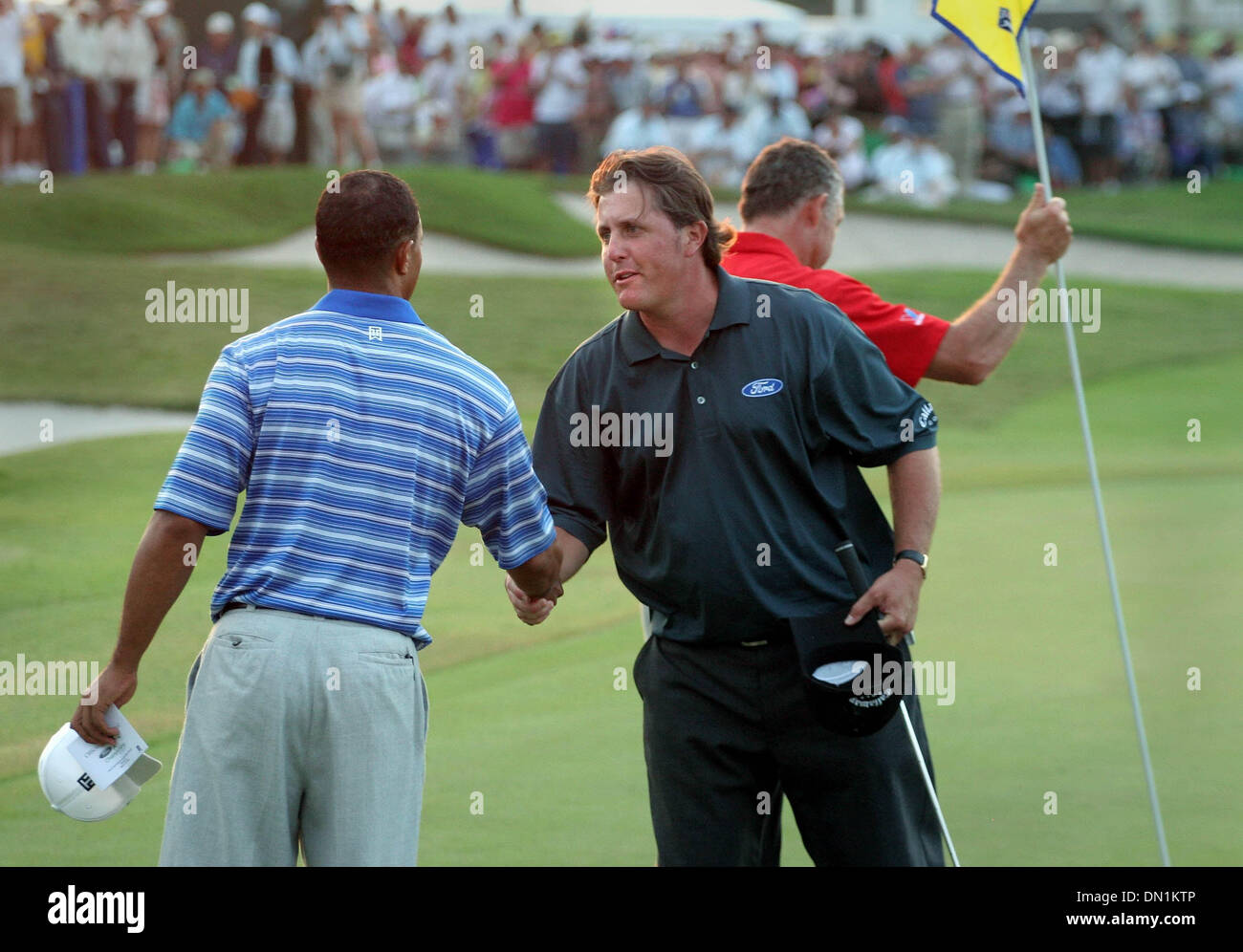 Mar 04, 2006; Miami, FL, USA; Tiger Woods and Phil Mickelson shake hands at conculsion of round three.  Mandatory Credit: Photo by Allen Eyestone/Palm Beach Post/ZUMA Press. (©) Copyright 2006 by Palm Beach Post Stock Photo