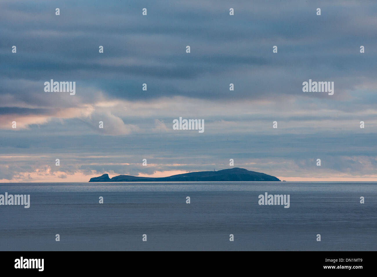 Fair Isle photographed from Sumburgh Head, Shetland, The island lies 24 miles southwest of Sumburgh Head. Stock Photo