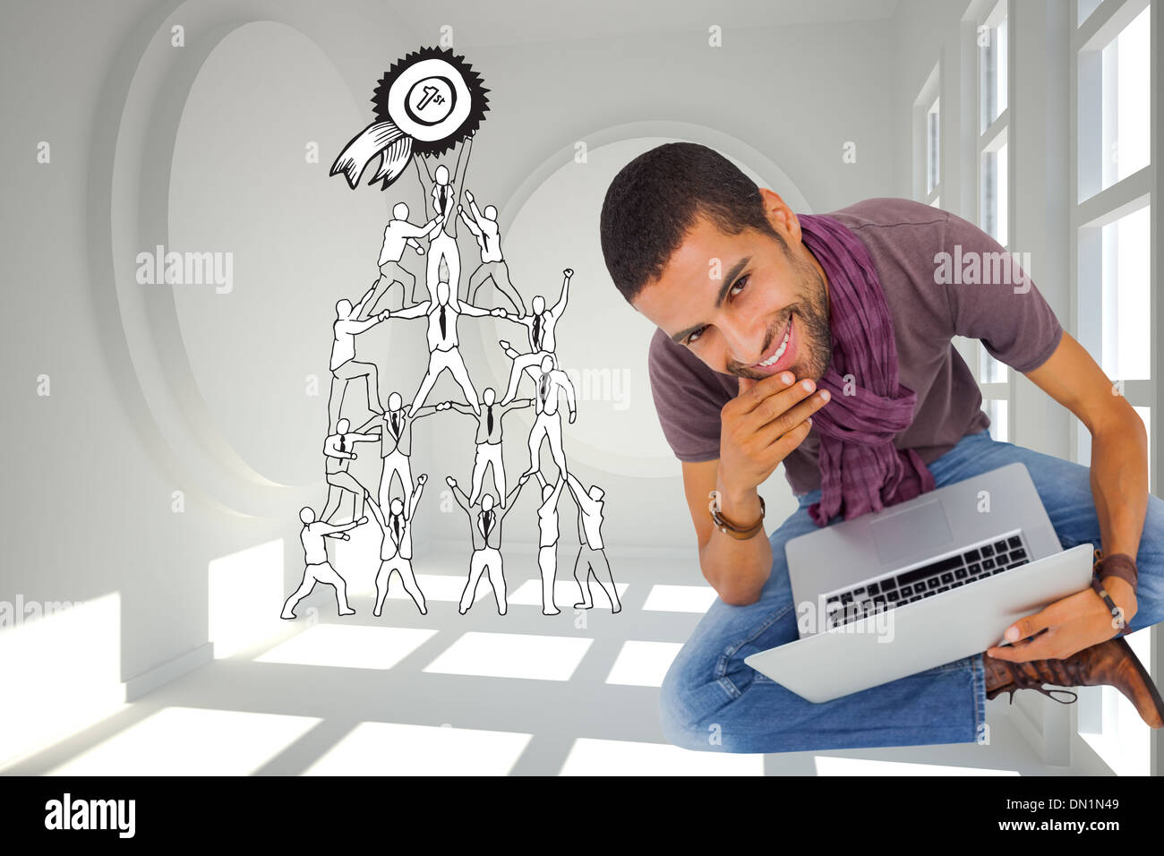 Composite image of thoughtful man sitting on floor using laptop and smiling at camera Stock Photo