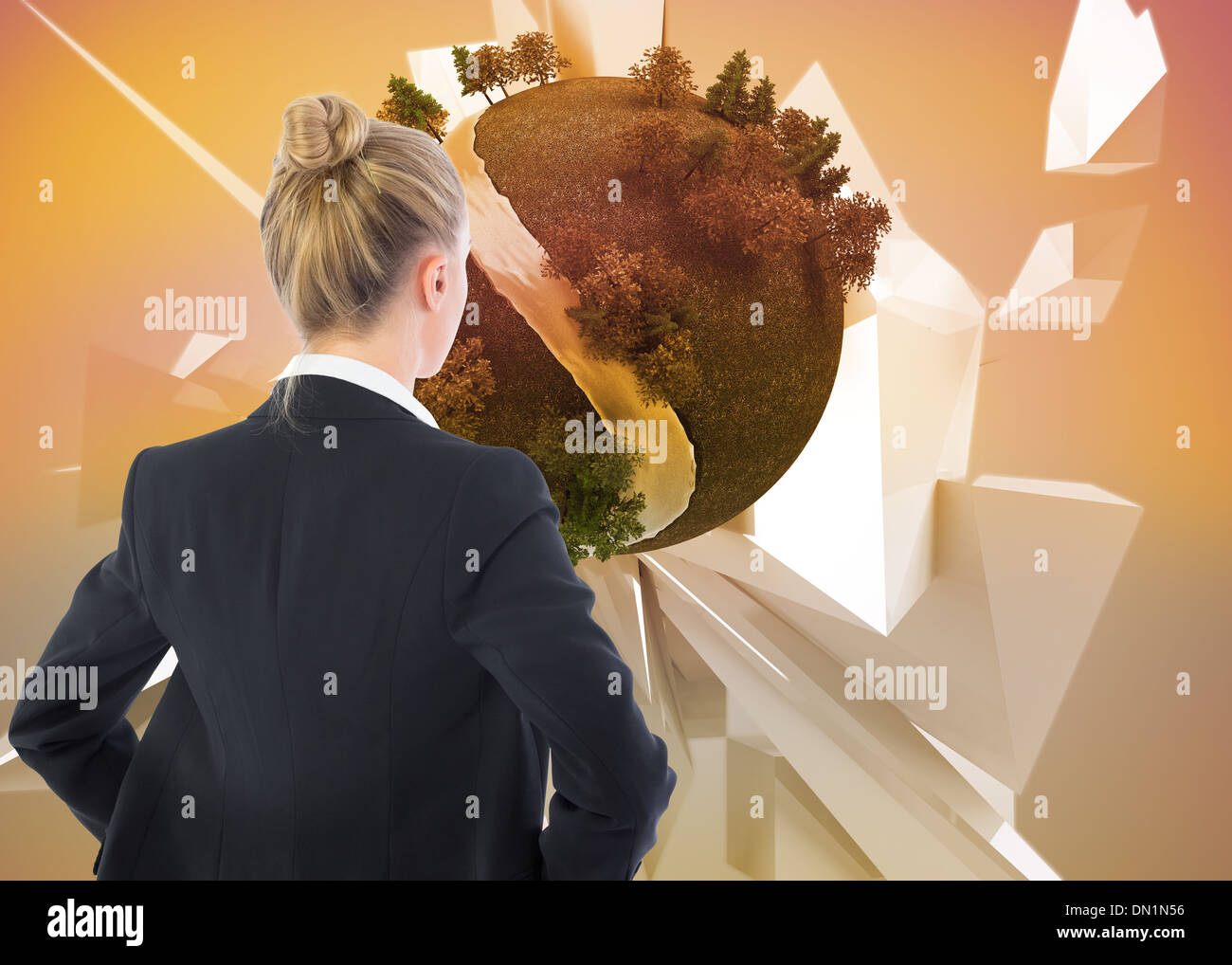 Composite image of businesswoman standing with hands on hips Stock Photo