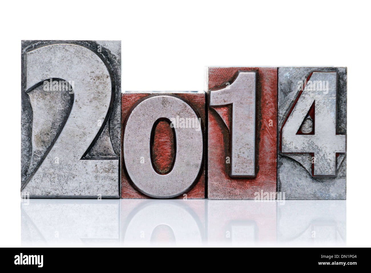 The numbers 2014 made from old metal letterpress type blocks, isolated on a white background. Stock Photo
