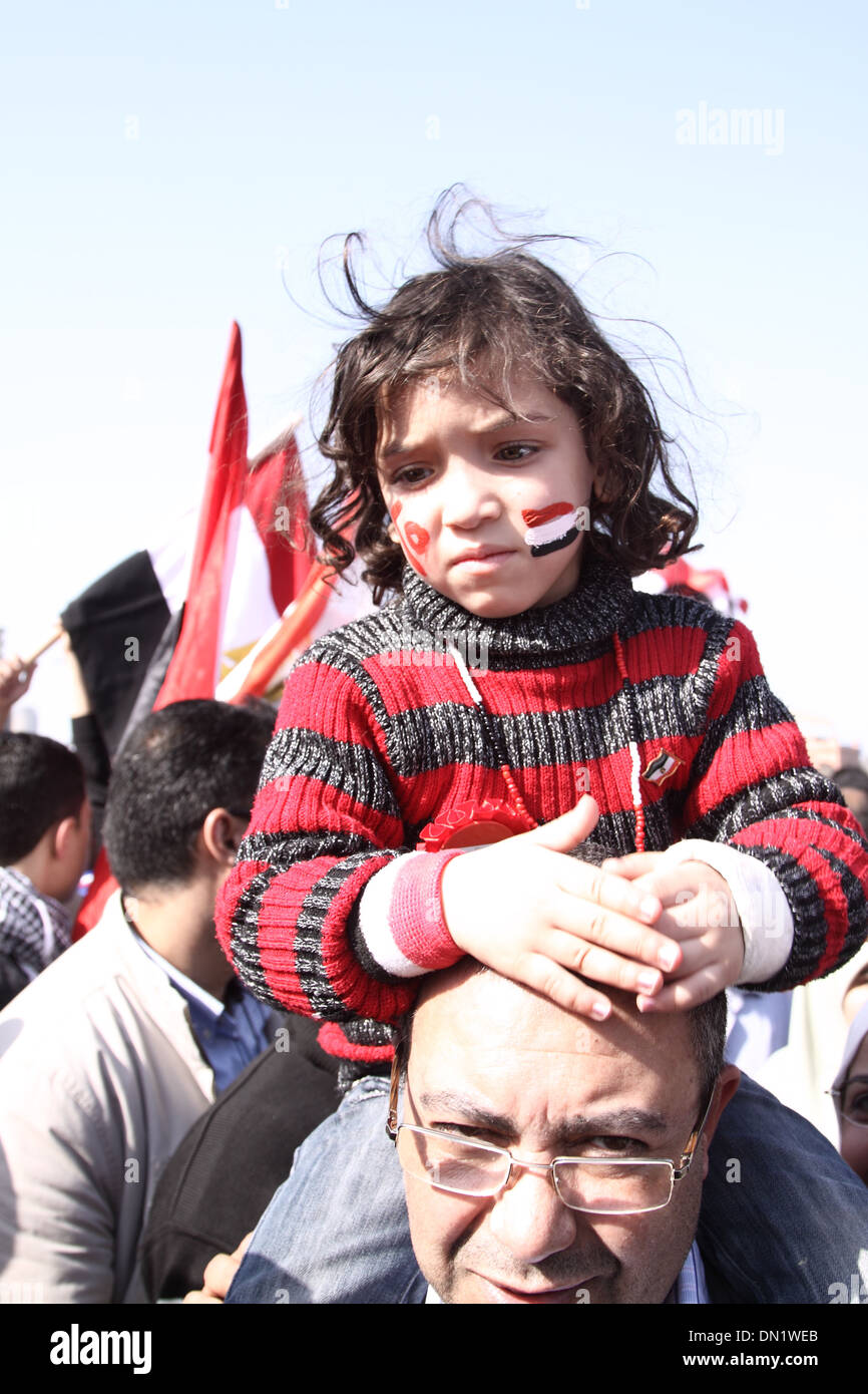 Father and Daughter participating in Egyptian revolution - 25th of January revolution activities @ Tahrir Square . Stock Photo