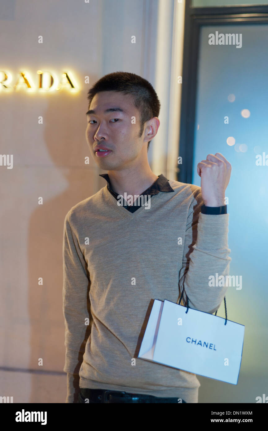 Paris, France, Young Chinese Tourist, Holding Chanel Bag, Shopping at Night, Avenue Montaigne, Prada Store Stock Photo