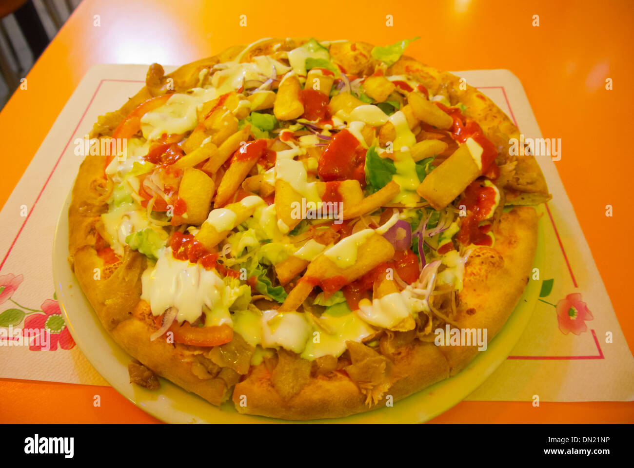 Pizza Kebab with kebab meat, french fries, vegetables and sauces Turin