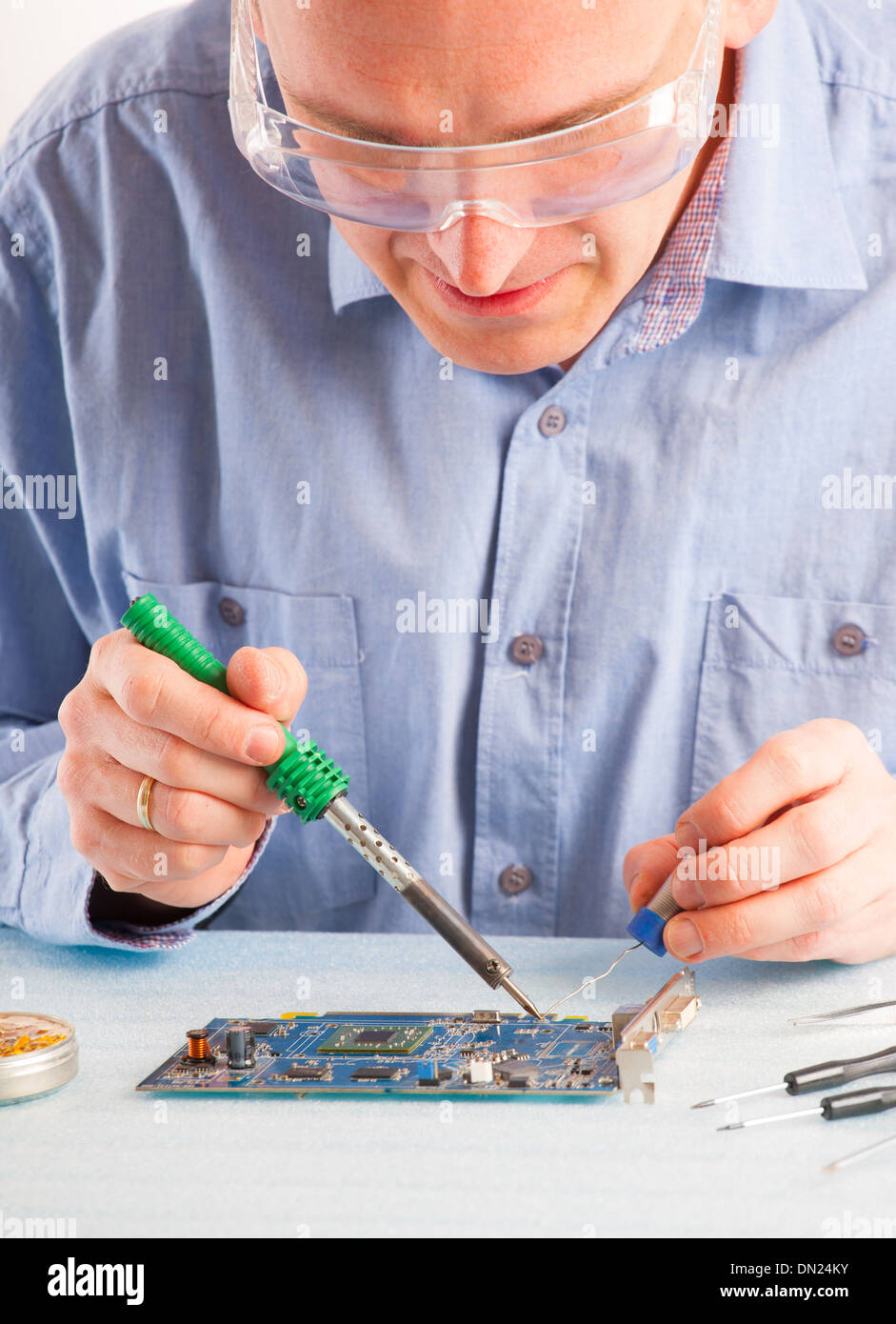 Man using soldering tool for the computer parts Stock Photo Alamy