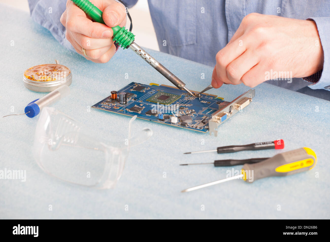 Man using soldering tool for the computer parts Stock Photo Alamy