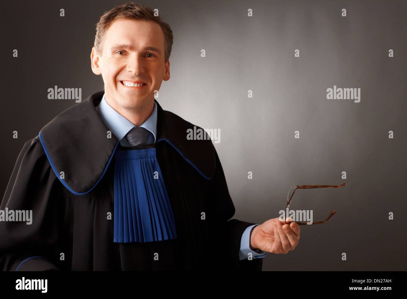 Attorney wearing classic gown thinking in court Stock Photo