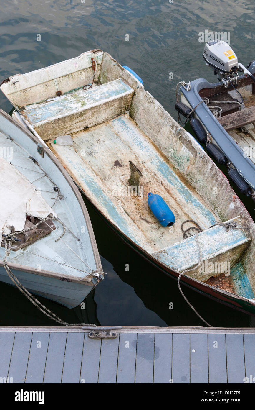 Old boats tied to a pontoon, viewed from above. Stock Photo