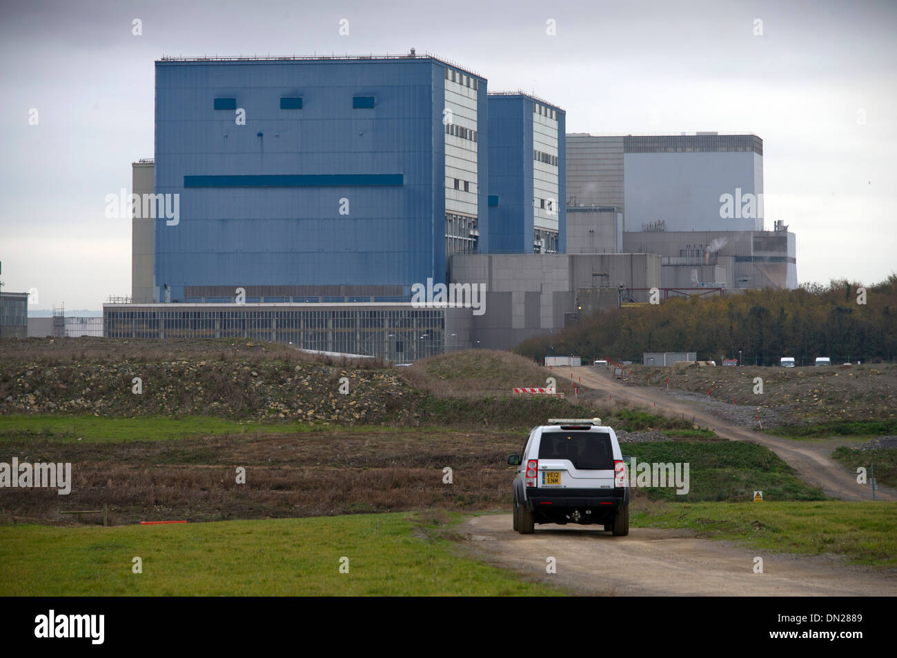 Hinkley Point B nuclear power station with Mike Harrison (Station Director B Station) in blue overalls and Nigel Cann (Hinkley C Construction Director Stock Photo