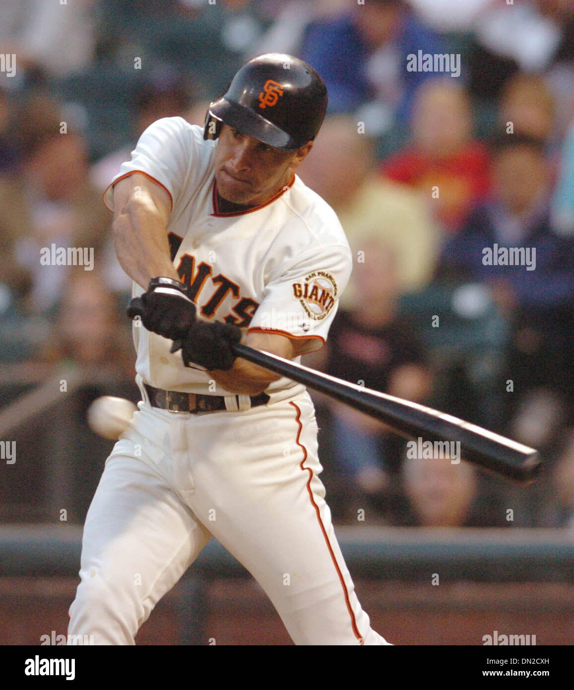 San Francisco Giants shortstop Omar Vizquel watches as the ball comes out  of his glove on a line-drive single by Washington Nationals' Ronnie  Belliard in the third inning of their baseball game