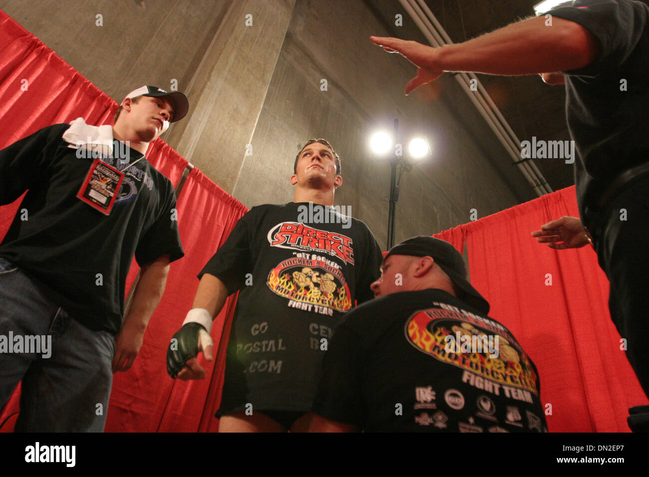 Aug 09, 2006; Las Vegas, NV, USA; DREW FICKETT eyes up his opponent, while being greased-up and receiving last minute advise form his corner team. He went on to win the night's opening fight at the Ultimate Fighting Championships in Las Vegas. Originally banned on TV and in most states in 1997 for it's no holds barred violence, the mixed martial arts style of fighting was resurrect Stock Photo