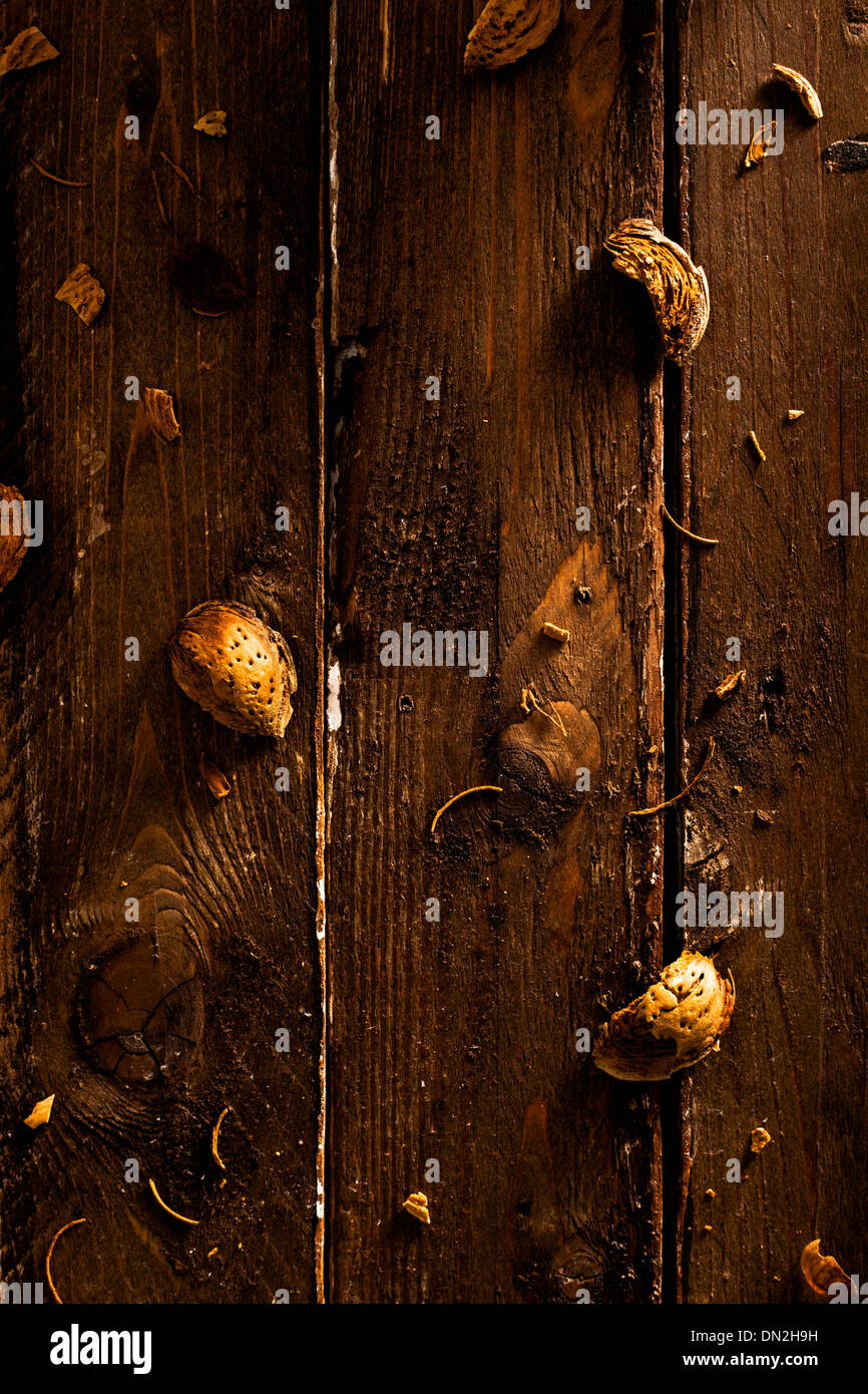 Scattered Almond Shells on Wood Stock Photo