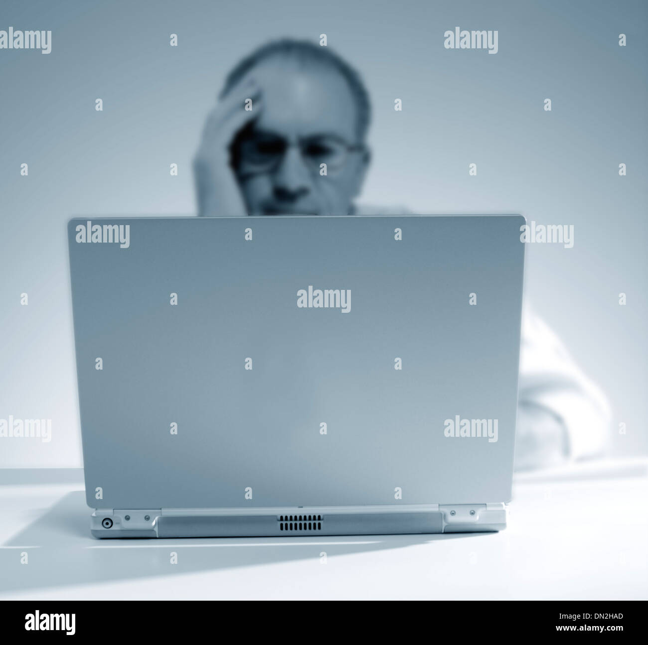 Man working on a laptop Stock Photo