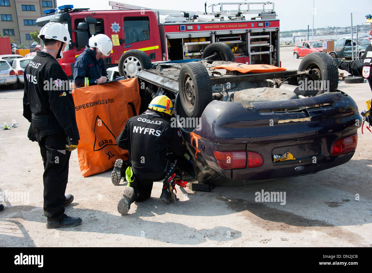 Firefighters Extricating Casualty from RTC SIMULATION Stock Photo