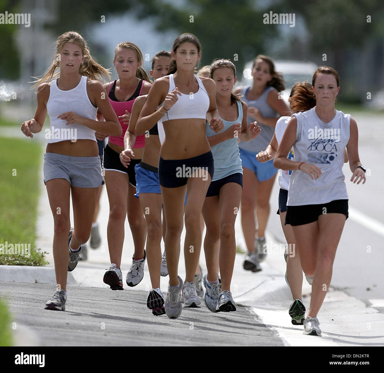 Aug 31, 2006; Boca Raton, FL, USA; Girls on the Spanish River High School  cross country team run along Yamato Road on a training run, Thursday  afternoon. (L-R front) Runner in grey
