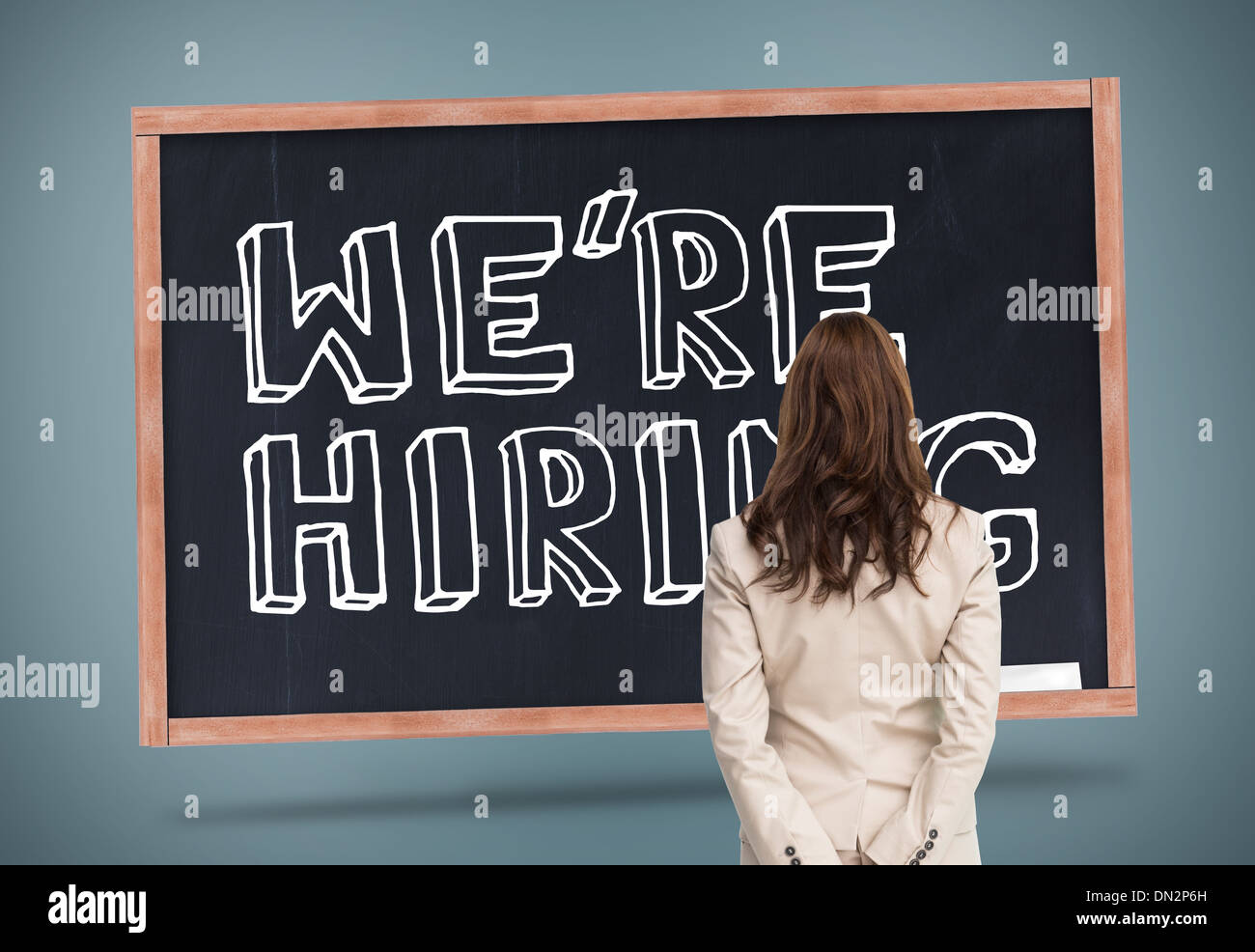 Composite image of rear view of businesswoman Stock Photo - Alamy