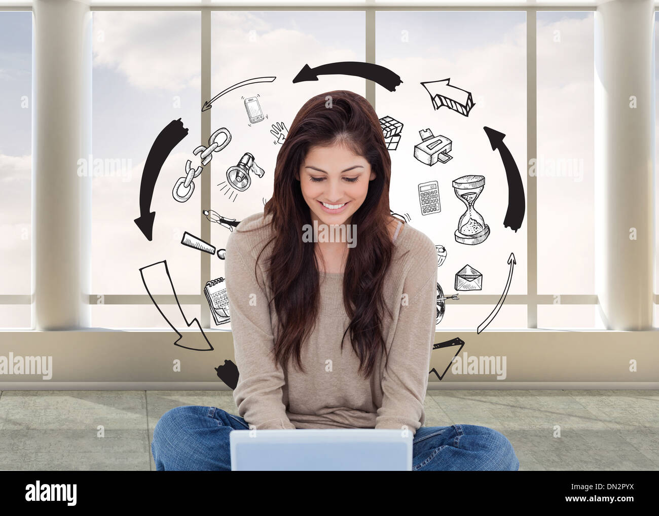 Composite image of brunette sitting on floor using laptop Stock Photo