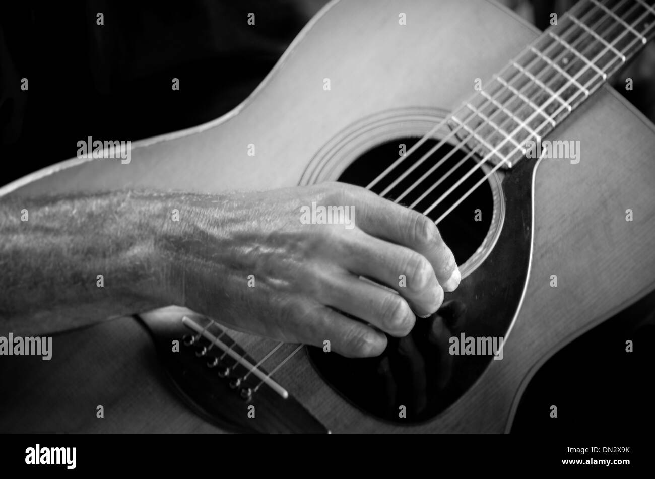 Hands with musical instrument Stock Photo