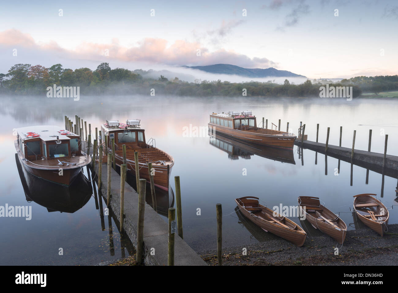 Boats moored on Derwentwater near Friar's Crag, Keswick, Lake District, Cumbria, England. Autumn (October) 2012. Stock Photo