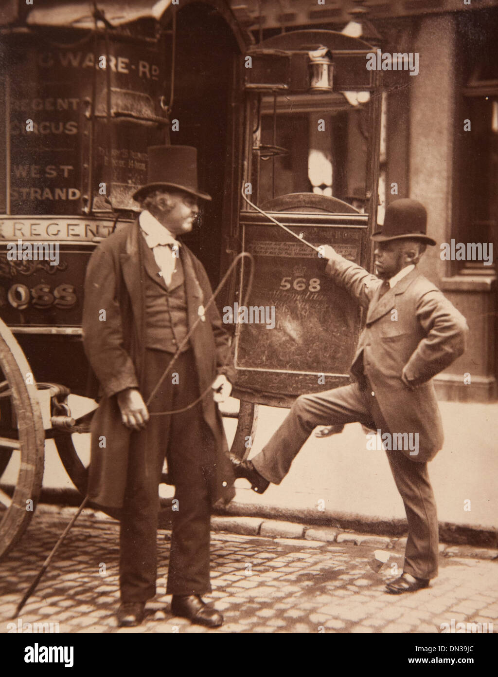 Photograph showing 'Cast-Iron Billy' (a driver, holding whip) in the Street Life in London book Stock Photo