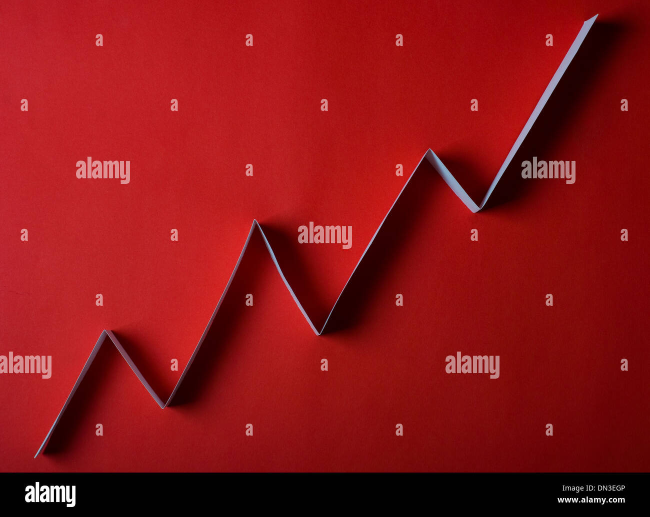 white arrow graph on red background Stock Photo