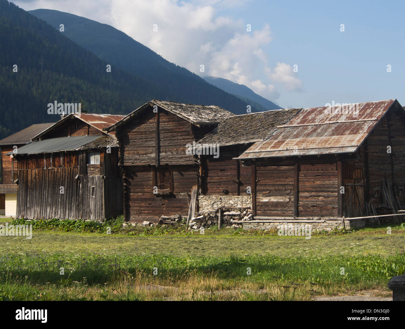 Old typical traditional wooden timber houses in the village Ulrichen in the district of Goms in the Swiss alps Stock Photo