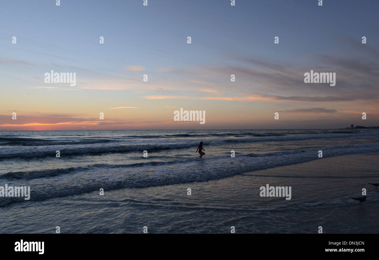 Sunset and swimmer in waves Siesta Key beach, Florida Stock Photo Alamy