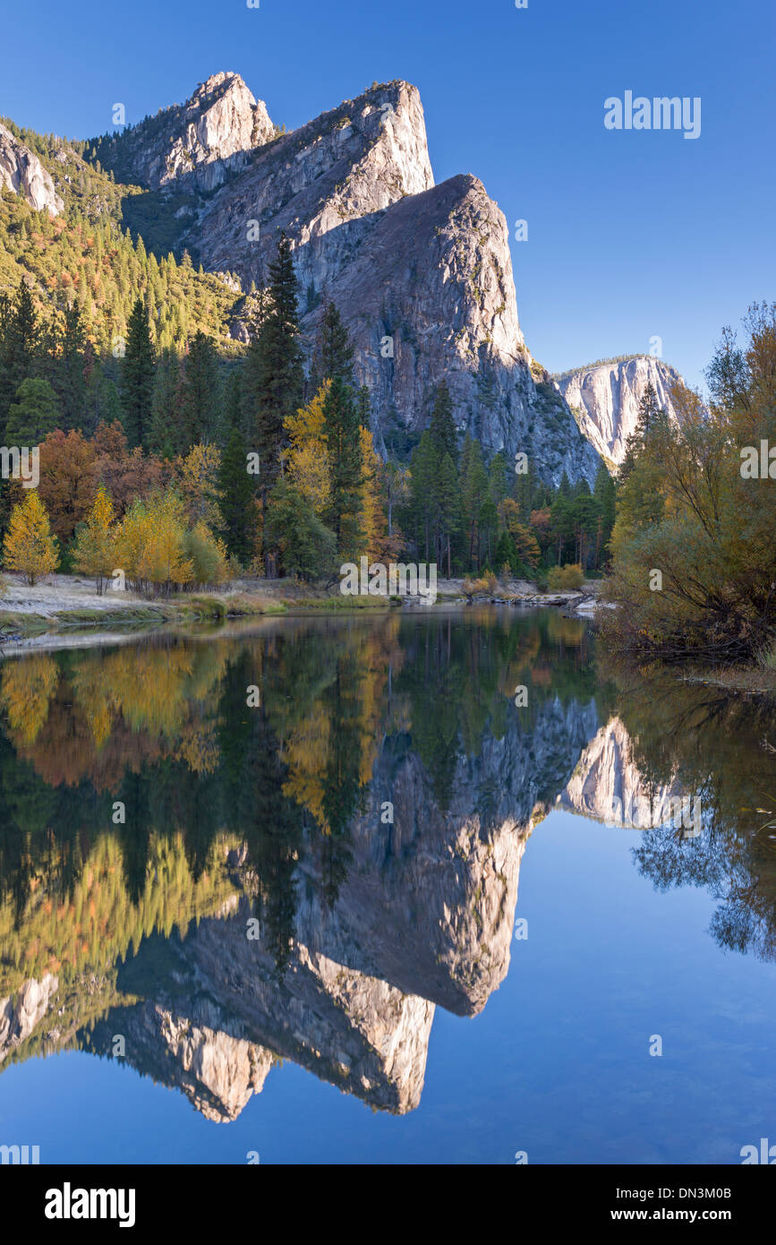 The Three Brothers reflected in the Merced River at dawn, Yosemite Valley, California, USA. Autumn (October) 2013. Stock Photo
