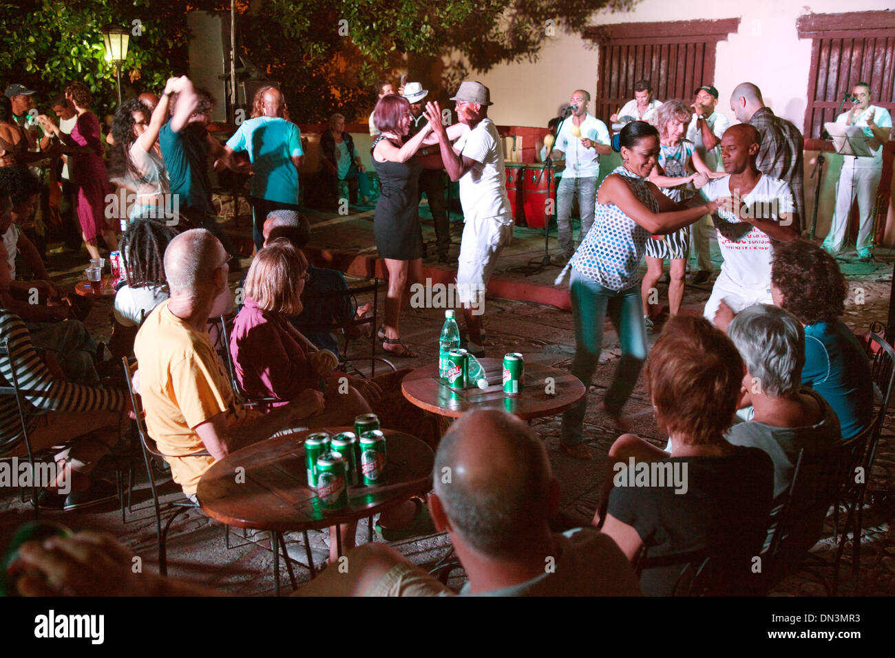 People dancing salsa outdoors in a bar late at night, Trinidad, Cuba, Caribbean, Latin America Stock Photo