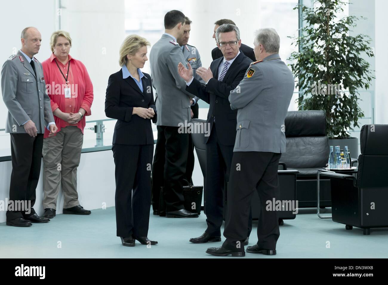 Berlin, Germany. 18th Dec, 2013. Chancellor Angela Merkel and Ursula von der Leyen (CDU), Minister of Defence, receives family members of the soldiers as well as policemen who are in the foreign assignment, to a Christmas conversation at the Chancellery in Berlin. / Picture: (r) Ursula von der Leyen (CDU), Minister of Defence, Thomas de Maiziere (CDU), Minister of Interior, and Volker Wieker, Chief of Staff of the armed forces.Photo: Reynaldo Paganelli/NurPhoto Credit:  Reynaldo Paganelli/NurPhoto/ZUMAPRESS.com/Alamy Live News Stock Photo